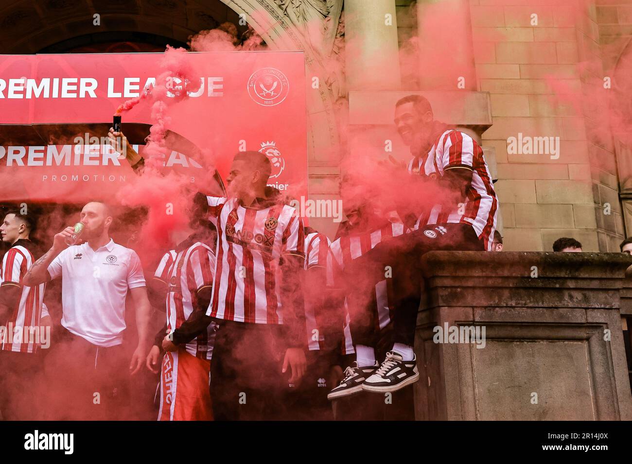 William Osula holds a flare up during Sheffield United Premier League Promotion Parade at Sheffield Town Hall, Sheffield, United Kingdom, 11th May 2023  (Photo by News Images) Stock Photo