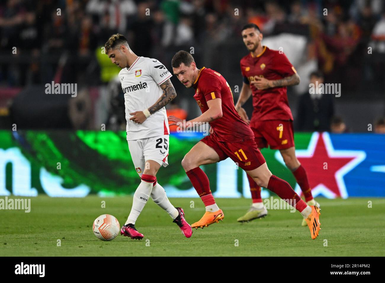 Rome, Italy. 11th May, 2023. Bayer Leverkusenâ&#x80;&#x99;s Exequiel Palacios defend ball from AS Romaâ&#x80;&#x99;s Andrea Belotti during semifinal Europe League soccer match between AS Roma vs. Bayern Leverkusen at the Olimpico stadium in Rome, Italy, 11th of May 2023 Credit: Independent Photo Agency/Alamy Live News Stock Photo