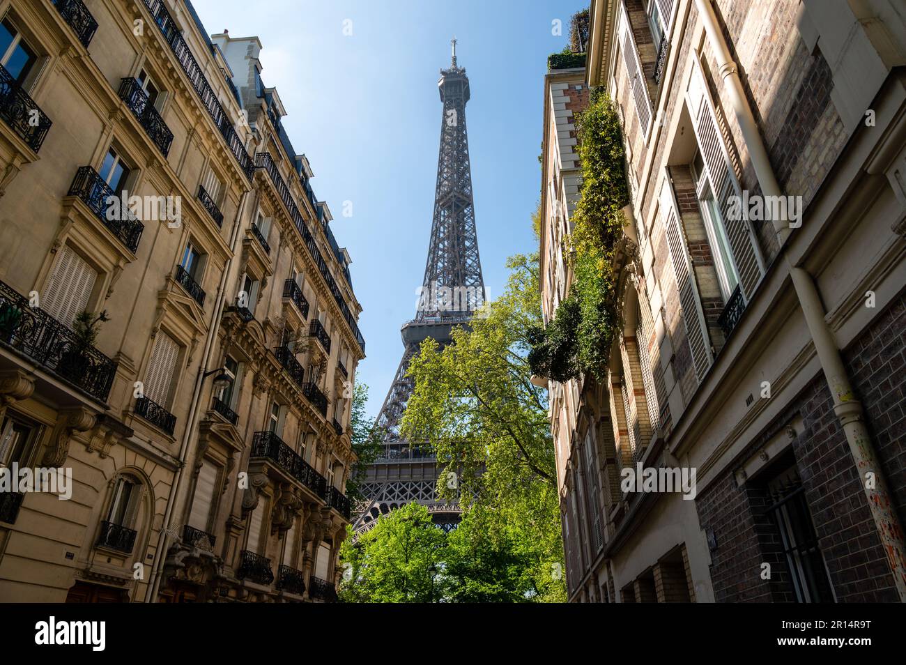 The Eiffel Tower view between palaces in Rue de l'Universite street ...