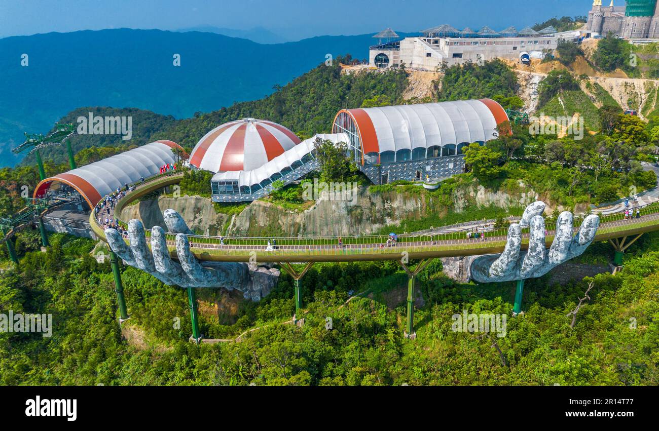Aerial view of the Golden Bridge in Ba Na hills, Da Nang, Vietnam. Lifted by two giant concrete