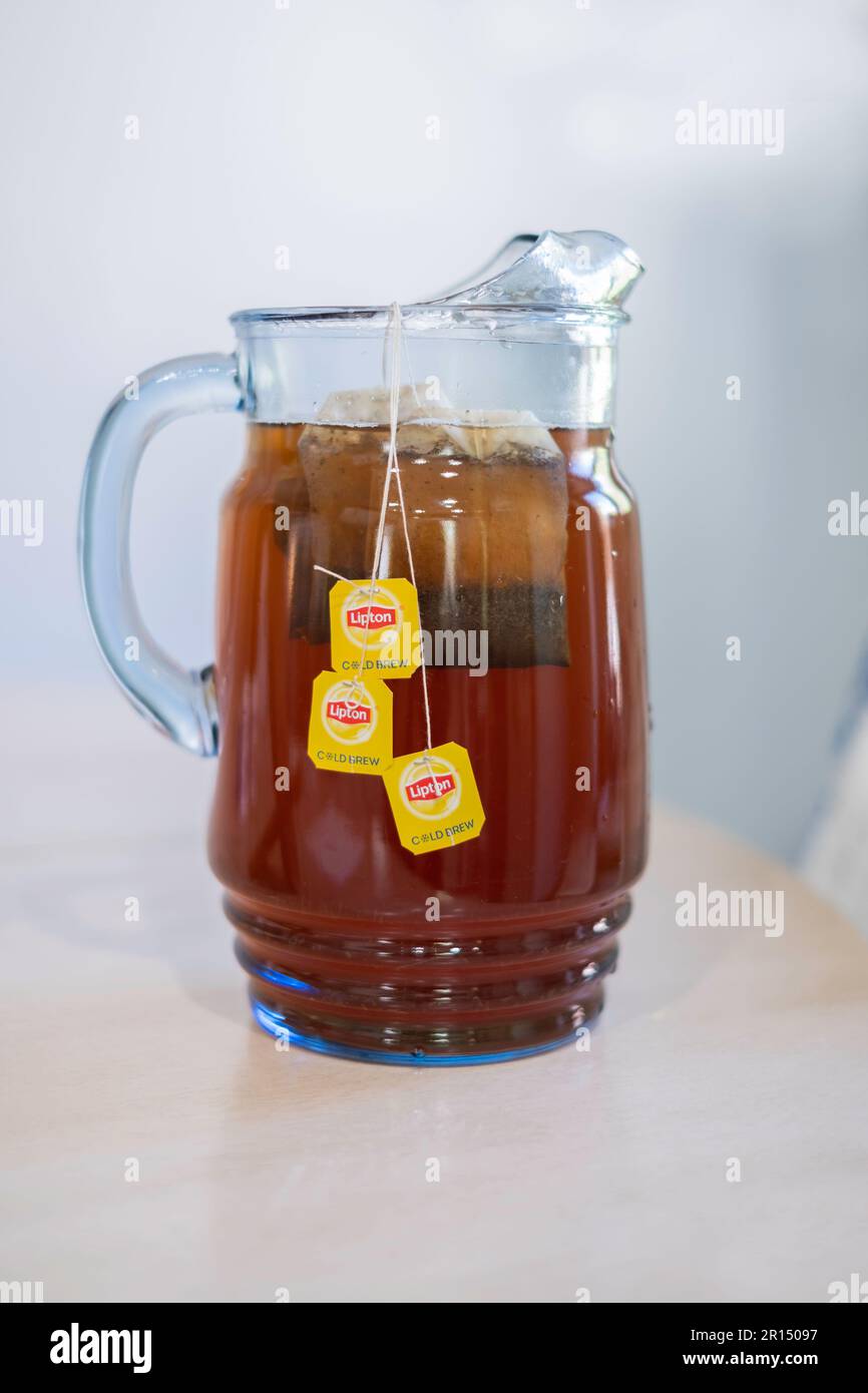 Glass pitcher with Lipton's 'cold brew' family size teabags making tea in cold water. USA Stock