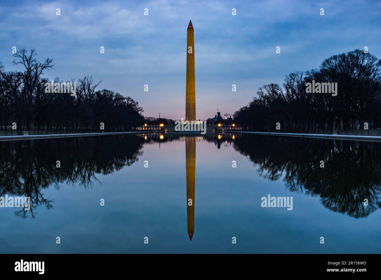 The Washington Monument at dawn in Washington DC with the reflecting pool Stock Photo