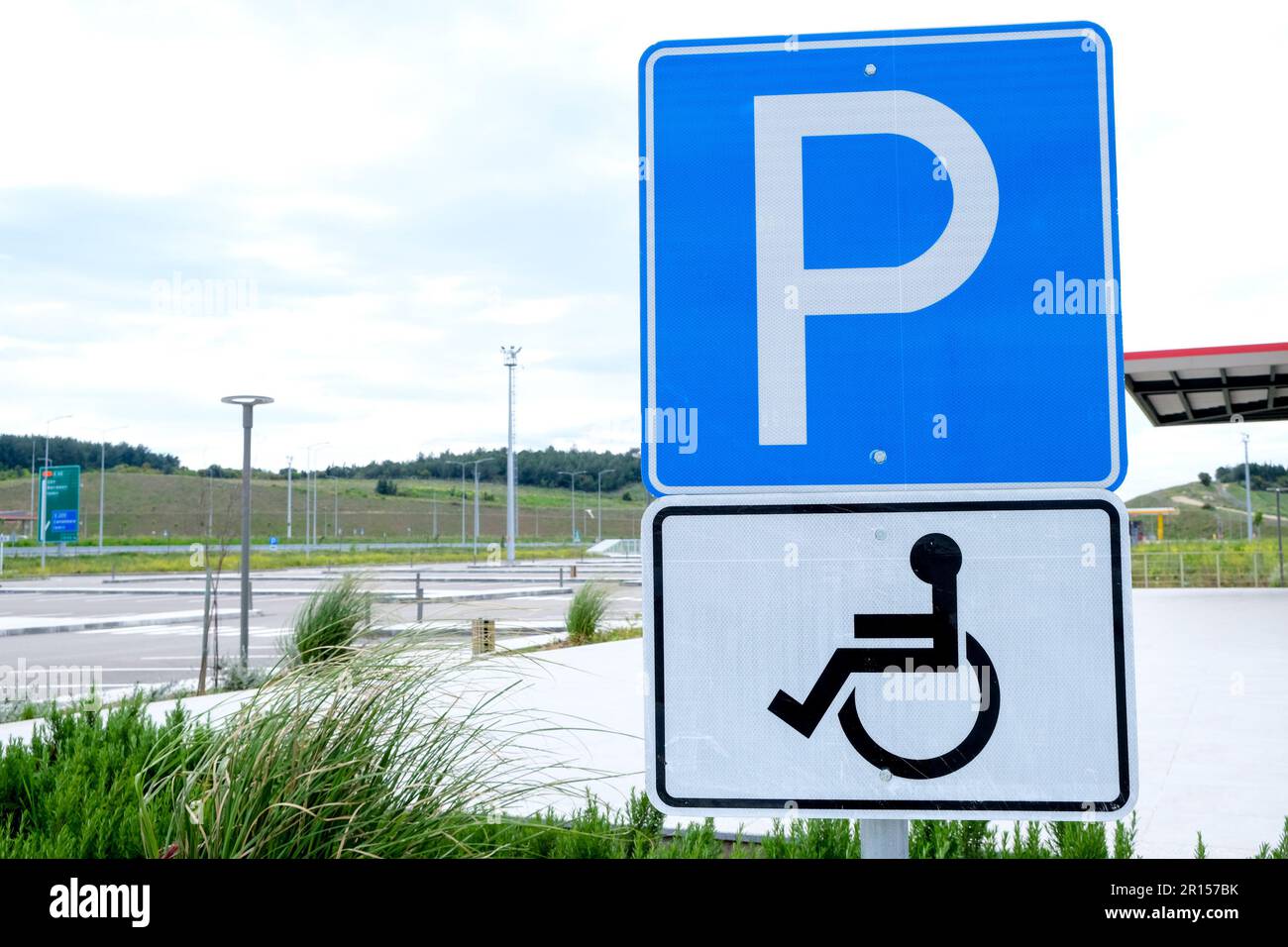 Close up disabled wheelchair parking sign with parking area. Open space area. Stock Photo