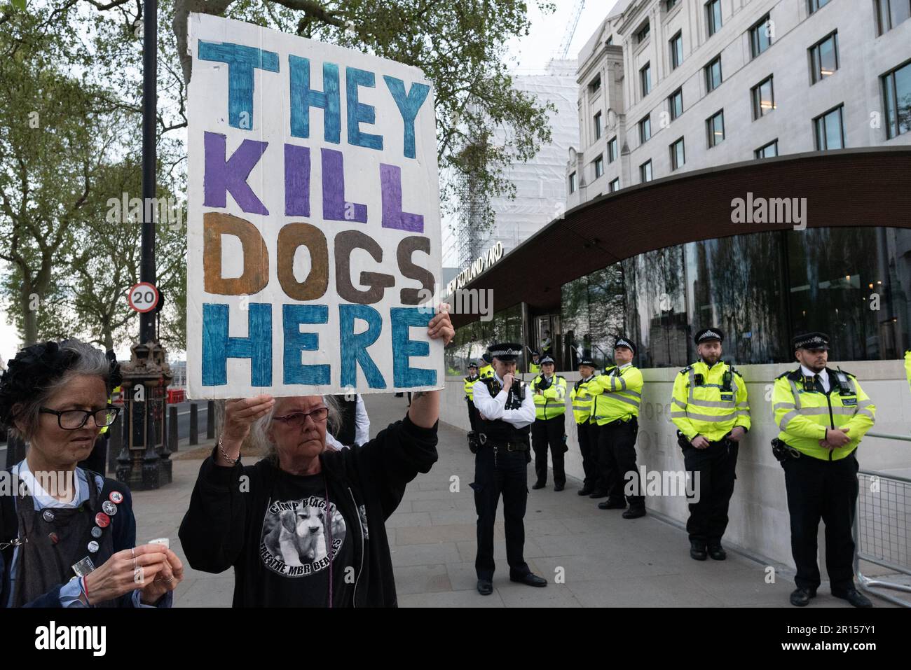 London, UK. 11 May, 2023. Animal rights activists stage a vigil outside the headquarters of the Metropolitan Police at New Scotland Yard for two dogs shot dead by police in Poplar, east London in a public incident in which the owner was also tasered. Police claim the dogs, named Marshall and Millions, were a 'significant threat to them' but activists maintain the killings, widely viewed on social media video, were cruel and unnecessary. Credit: Ron Fassbender/Alamy Live News Stock Photo