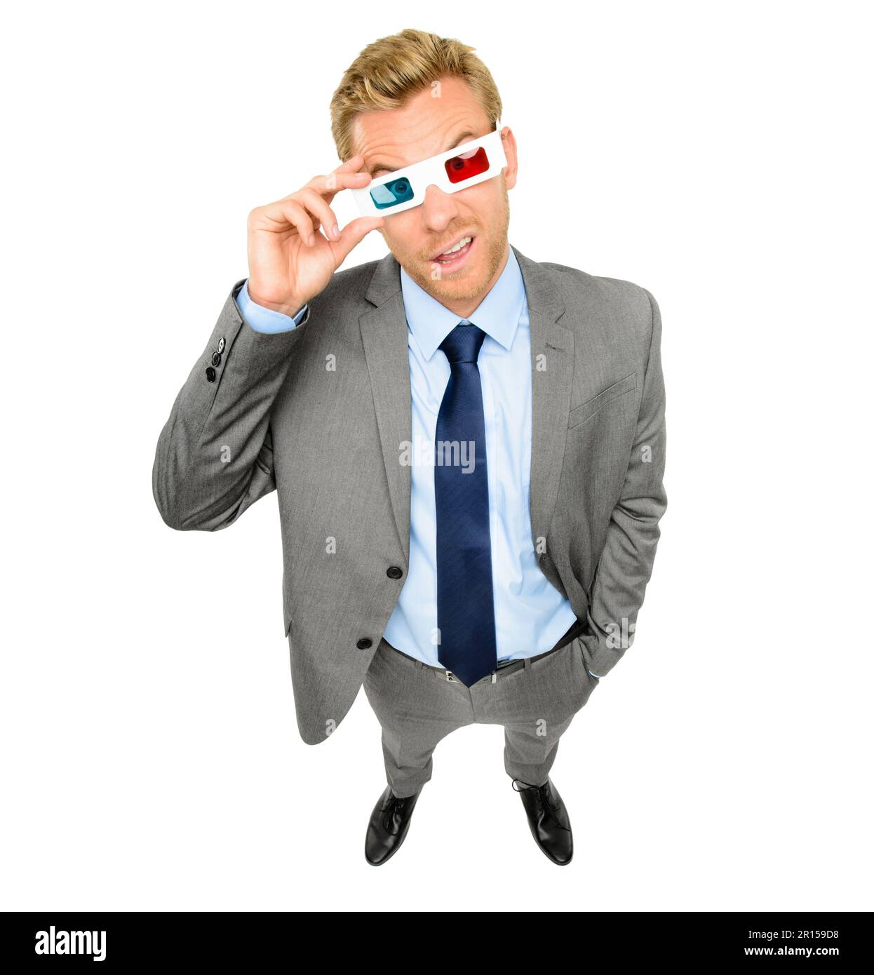 You have to see things from all angles. High angle shot of a handsome young businessman standing alone in the studio and wearing 3d glasses. Stock Photo