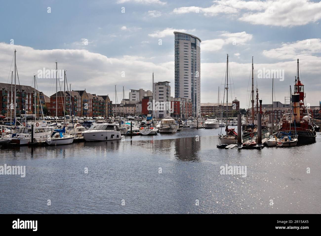 Swansea marina full of boats with the Tower, Wales UK. Quayside flats