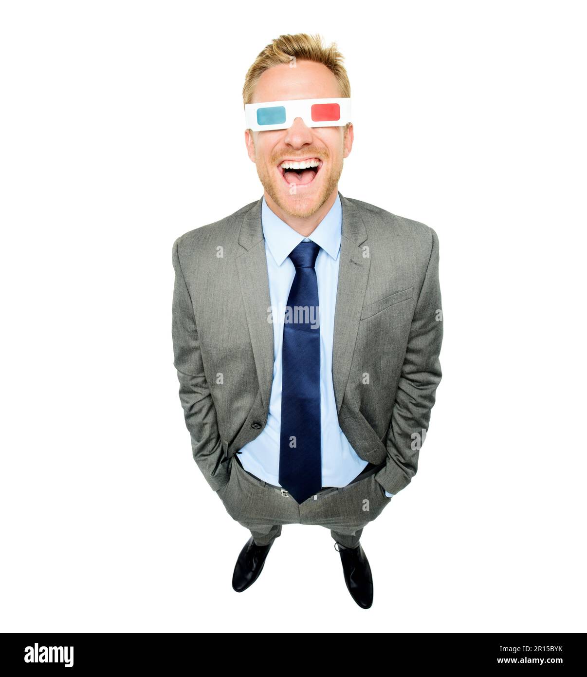 Seeing things from a different dimension. High angle shot of a handsome young businessman standing alone in the studio and wearing 3d glasses. Stock Photo