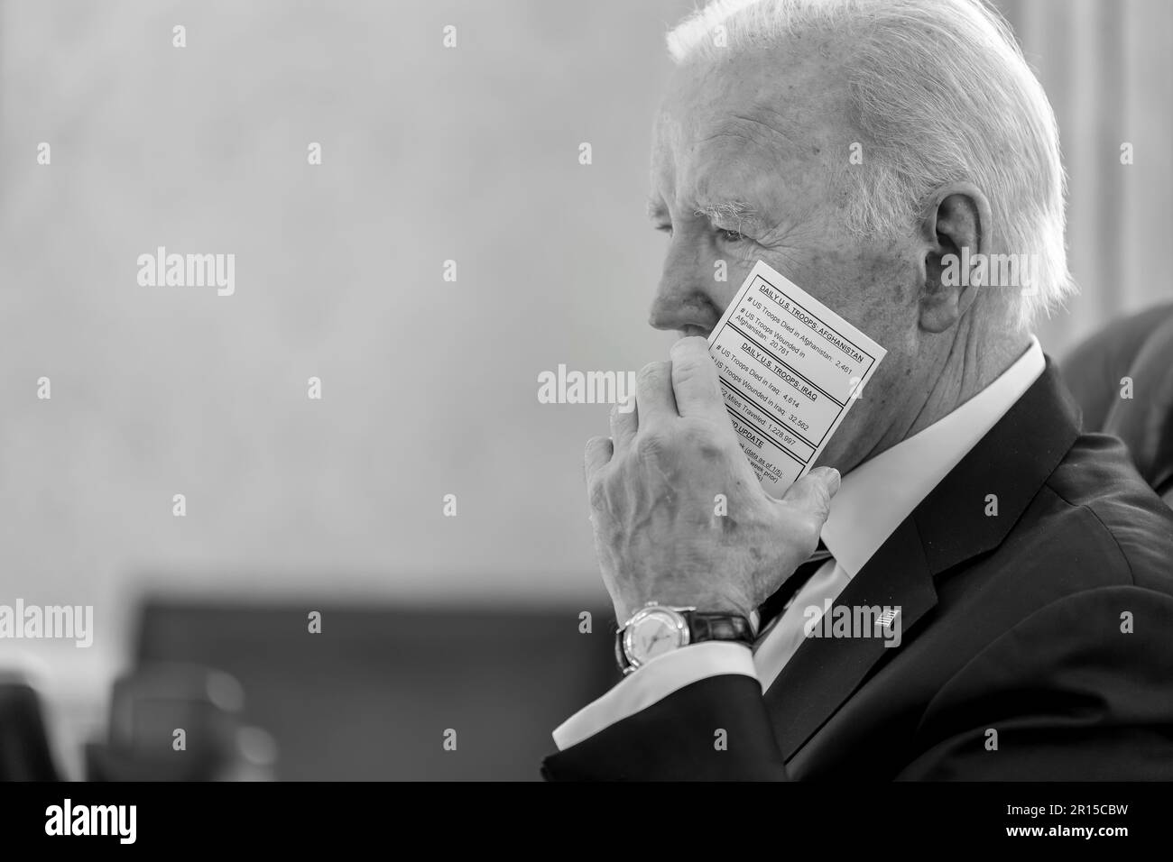 President Joe Biden holds a schedule card during a daily press meeting, Friday, January 13, 2023, in the Oval Office. (Official White House Photo by Adam Schultz) Stock Photo