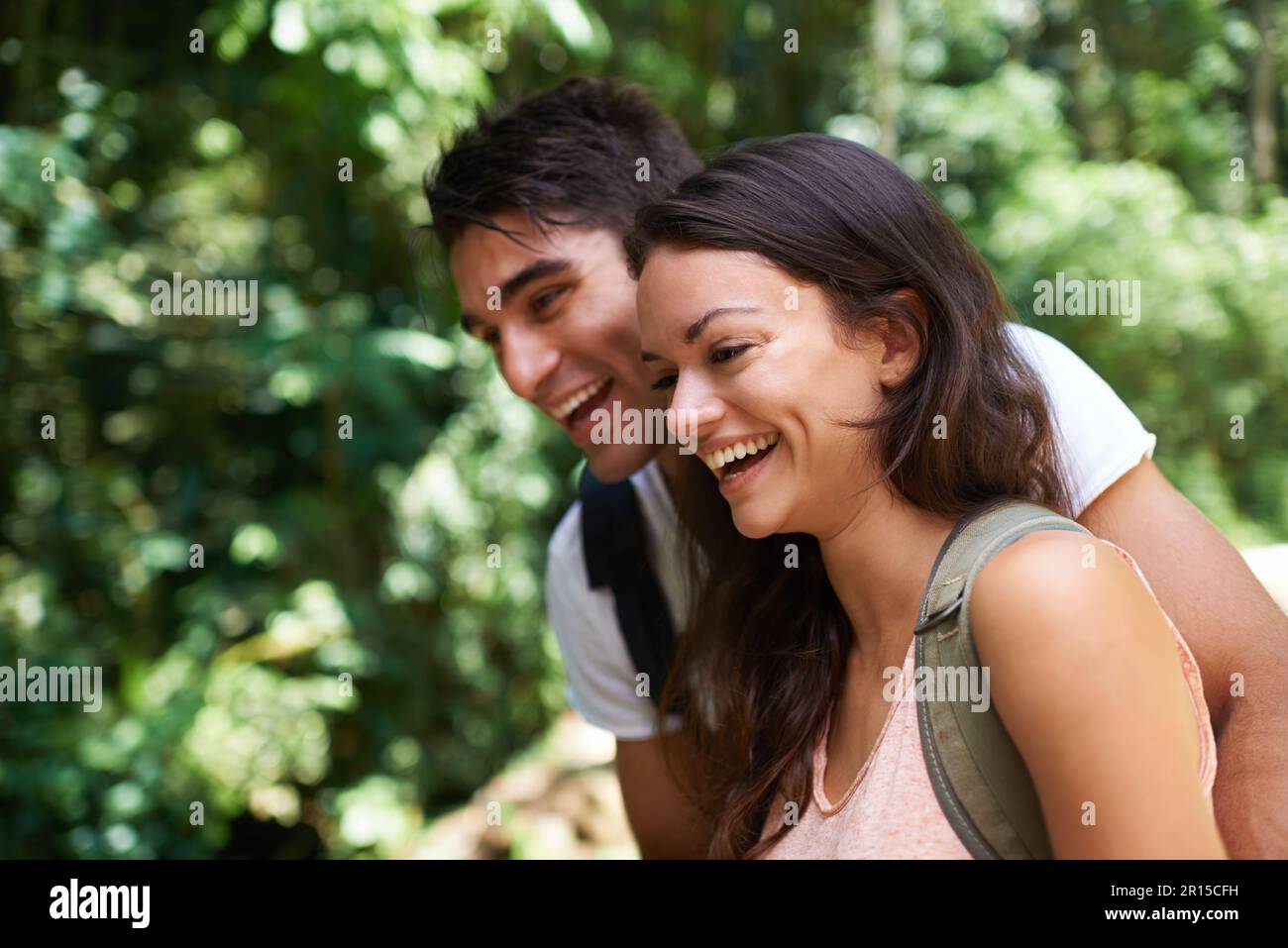 Appreciating the scenery. a young couple hiking through the forest ...