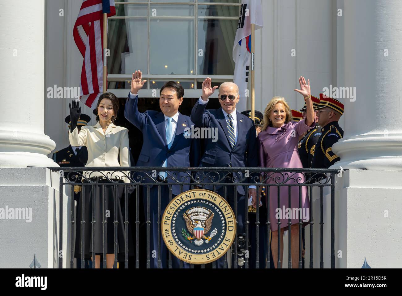President Joe Biden, First Lady Jill Biden, President of the Republic of Korea Yoon Suk Yeol and First Lady Mrs. Kim Keon Hee wave from the Blue Room Balcony, Wednesday, April 26, 2023, following the Official State Arrival Ceremony on the South Lawn. (Official White House Photo by Cameron Smith) Stock Photo