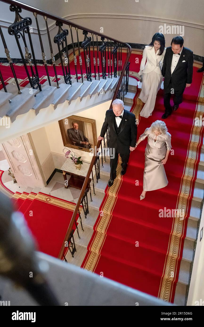 President Joe Biden and First Lady Jill Biden walk with President Yoon Suk Yeol of the Republic of Korea and Mrs. Kim Keon Hee down the Grand Staircase of the White House, Wednesday, April 26, 2023, prior to a State Dinner in their honor. (Official White House Photo by Adam Schultz) Stock Photo