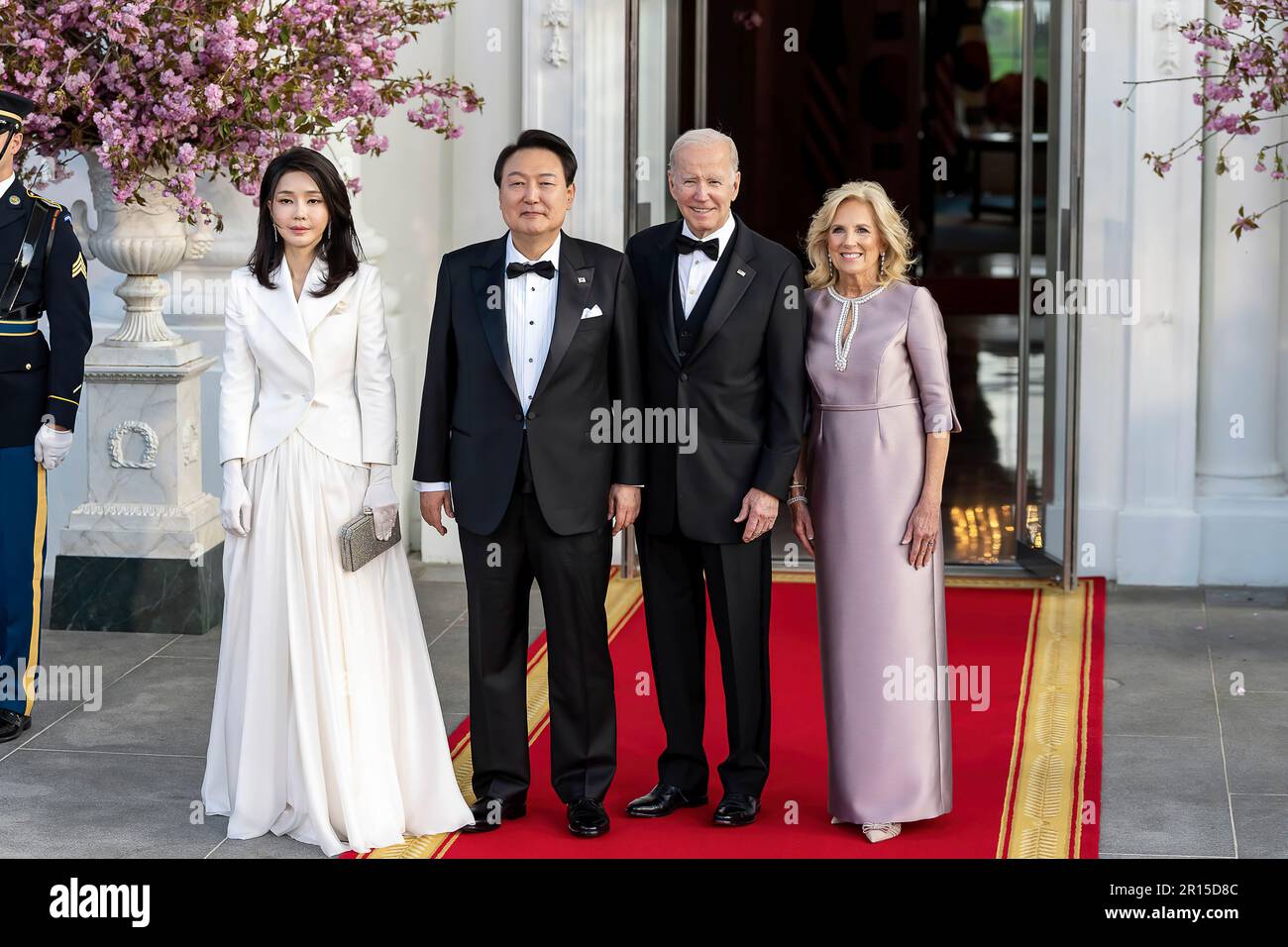 President Joe Biden and First Lady Jill Biden greet President Yoon Suk Yeol of the Republic of Korea and First Lady Mrs. Kim Keon Hee on the North Portico of the White House, Wednesday, April 26, 2023, prior to a State Dinner in their honor. (Official White House Photo by Cameron Smith) Stock Photo