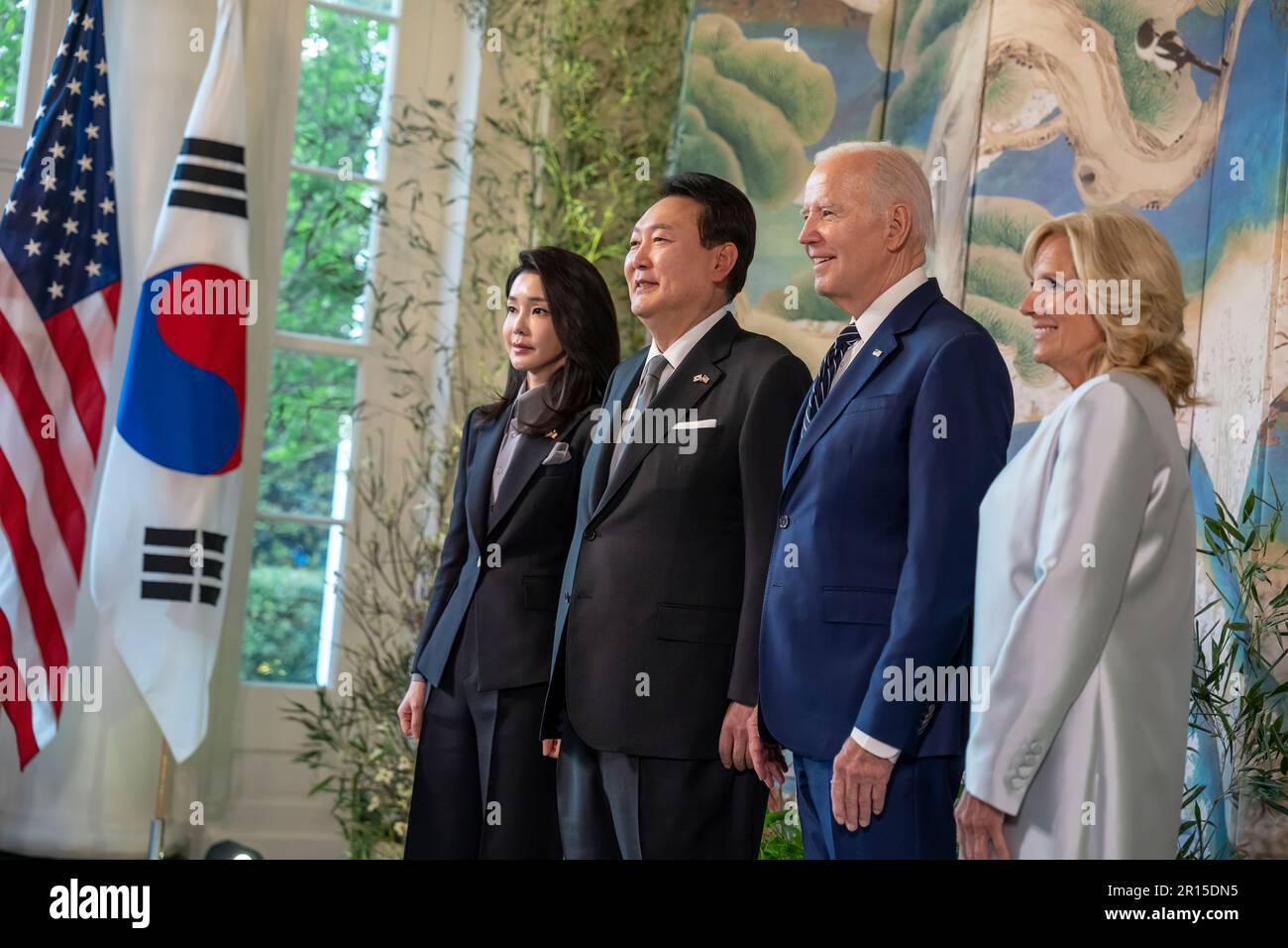 President Joe Biden and First Lady Jill Biden, President Yoon Suk Yeol of the Republic of Korea and First Lady of the Republic of Korea Mrs. Kim Keon Hee pose for a photo with the décor for the next day’s official State Arrival ceremony, Tuesday, April 25, 2023, in the Booksellers area of the White House. (Official White House Photo by Adam Schultz) Stock Photo