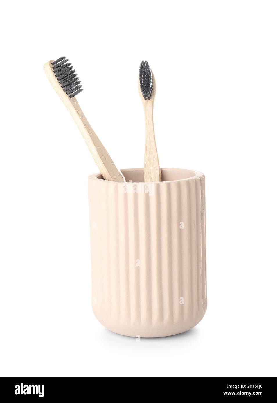 Holder with bamboo toothbrushes on white background Stock Photo - Alamy