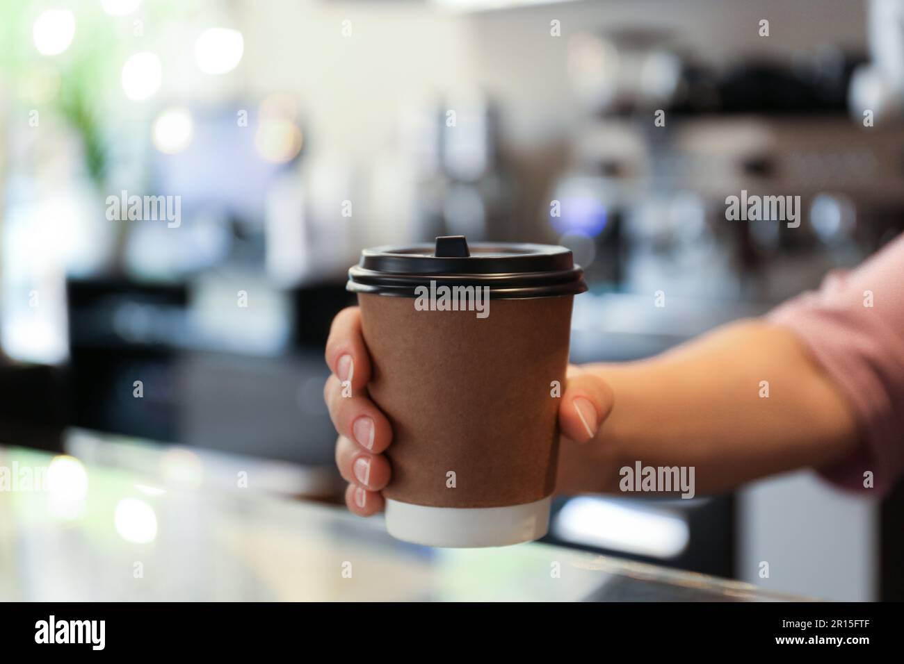 Barista putting takeaway coffee cup hi-res stock photography and images ...