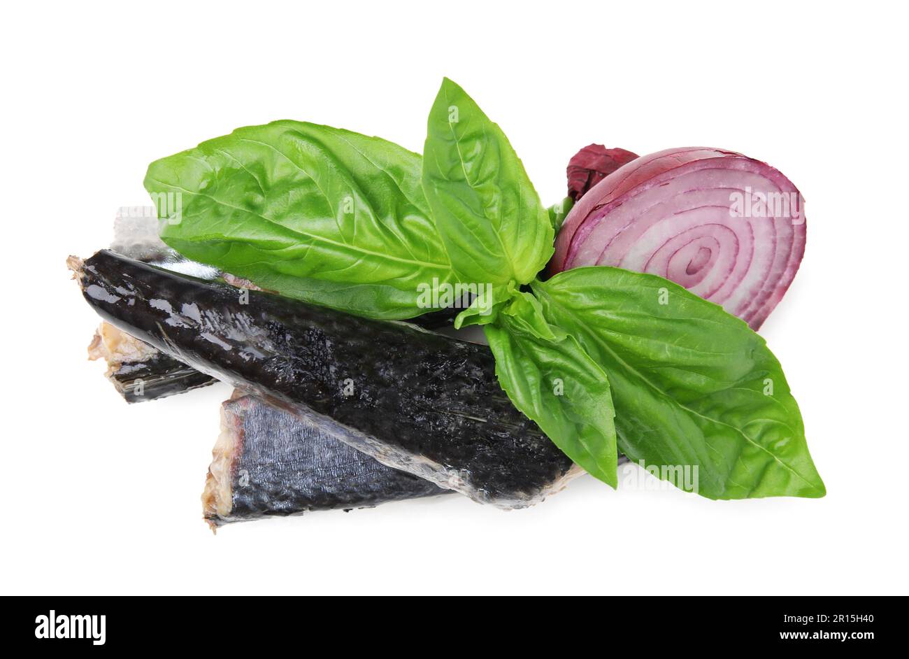 Canned mackerel fillets with red onion rings and basil on white ...