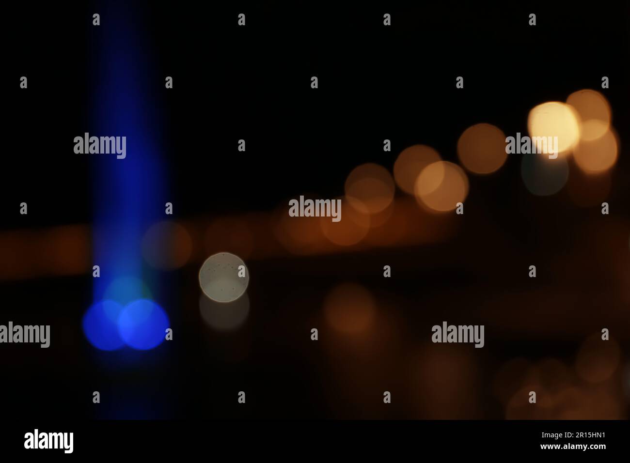 Blurred view of city with street lights at night. Bokeh effect Stock ...