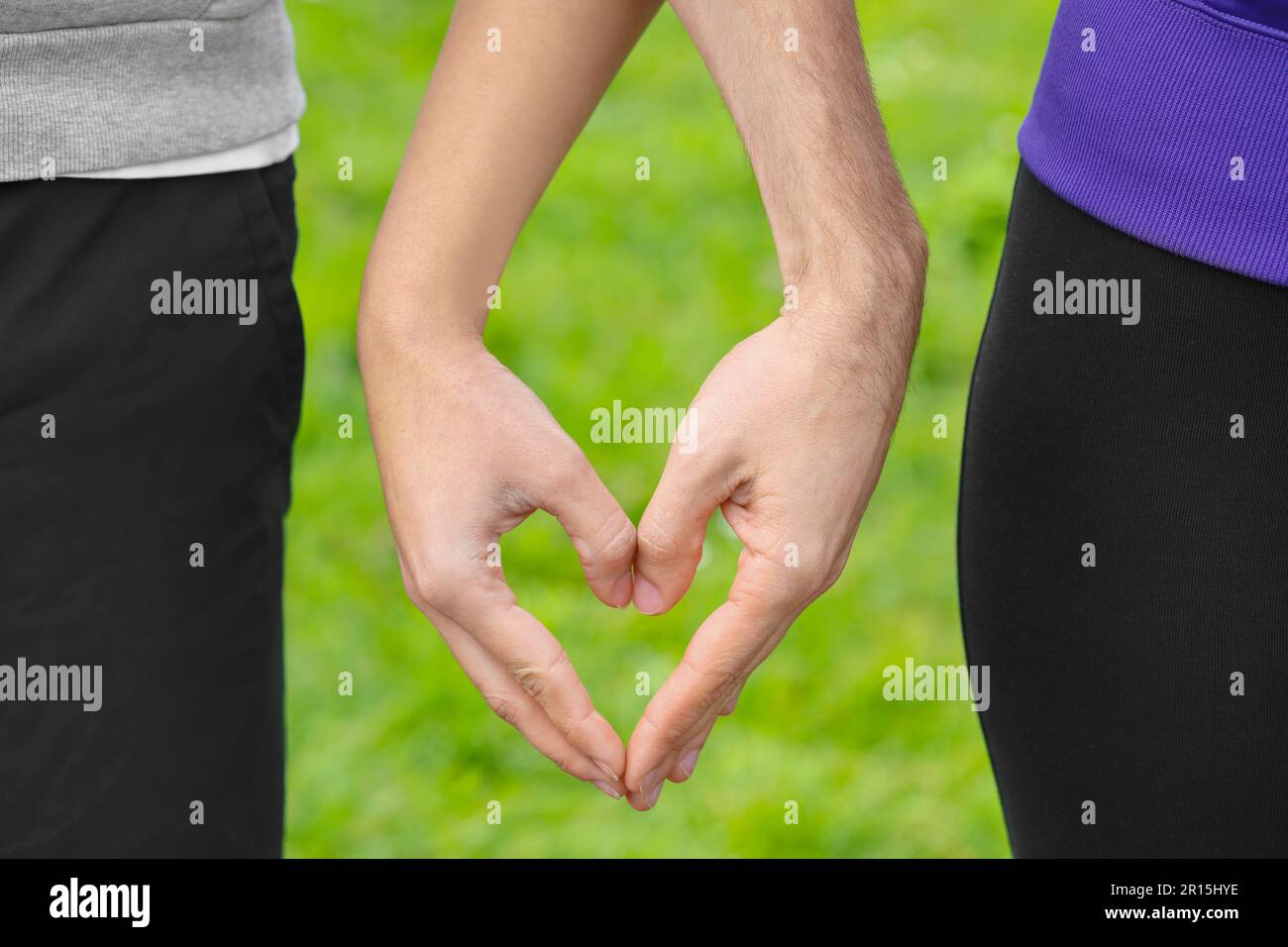 Couple making heart sign with hands hi-res stock photography and images ...