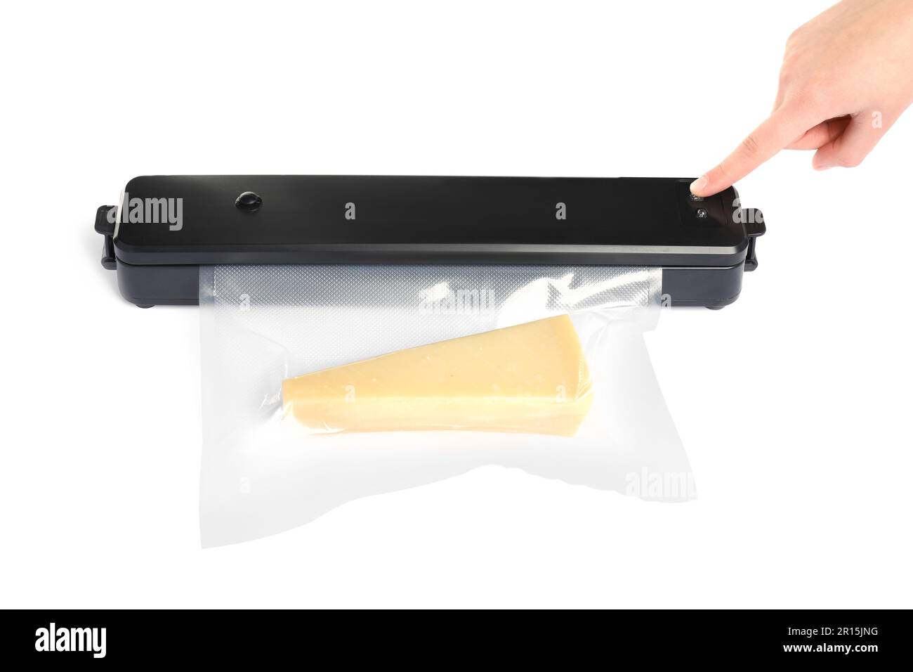 Woman packing cheese using vacuum sealer on white background, closeup