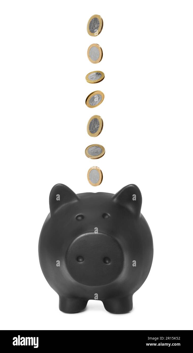 Euro coins falling into black piggy bank on white background Stock ...