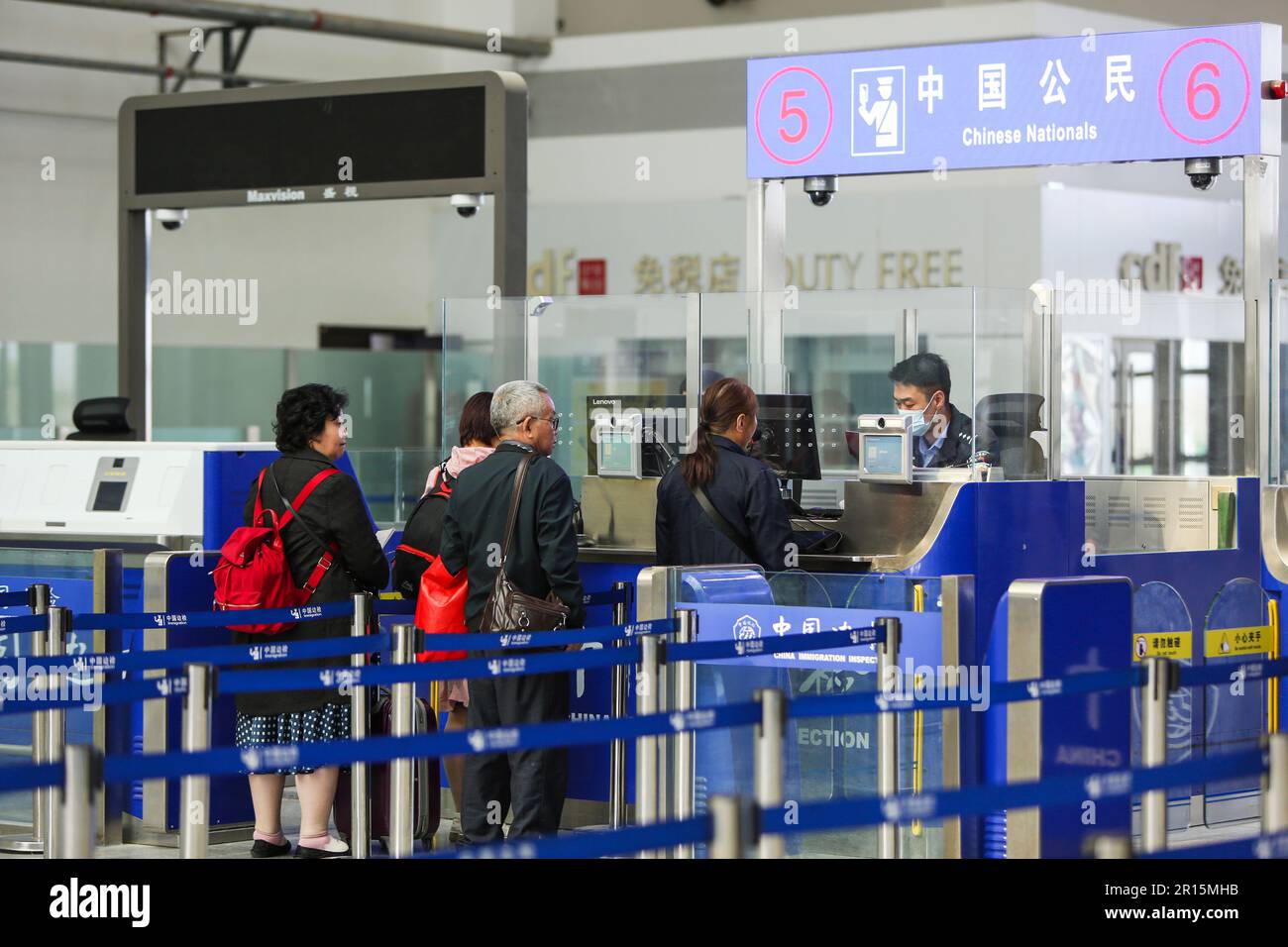 230512-horgos-may-12-2023-xinhua-people-queue-up-for