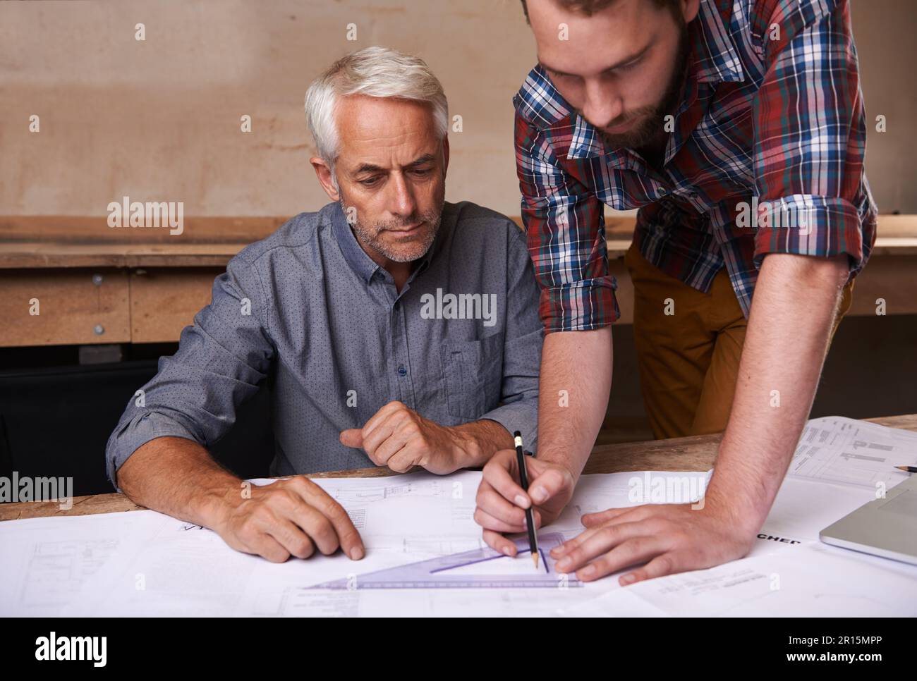 Turning his vision into reality. An architect drawing up plans Stock