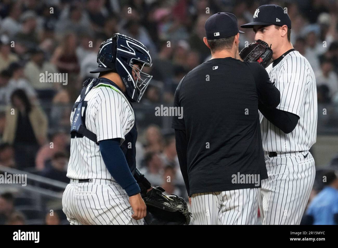 New York Yankees pitcher Ron Marinaccio, right, has a mound conference