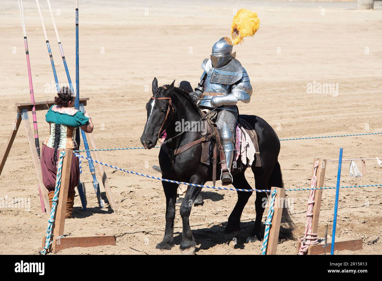 Folsom, CA, September 24, 2022. Unidentified male at the Folsom Renaissance Faire dressed as a knight ridding a black horse in the arena Stock Photo