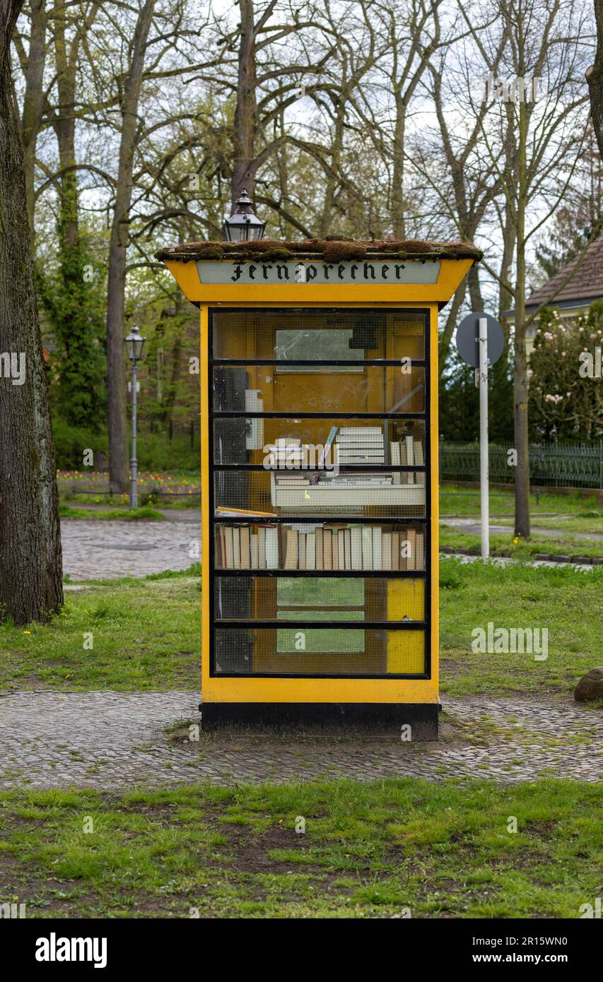 Yellow glass telephone booths with payphones are located on a pedestrian  street. Obsolete means of telephone communication in free access. Bialystok  Stock Photo - Alamy