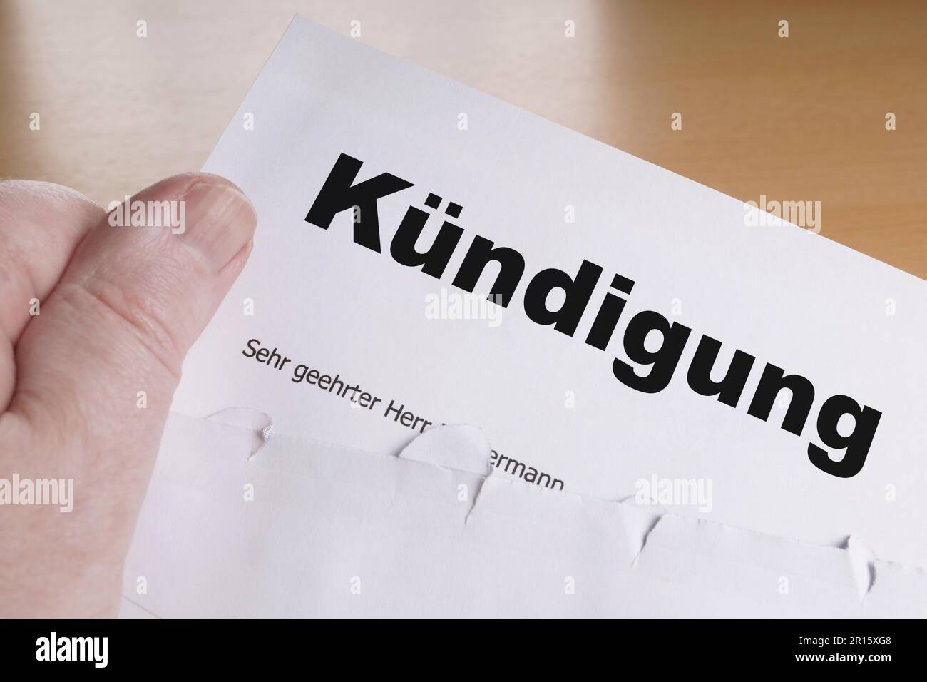Kuendigung hand holding german termination letter Stock Photo
