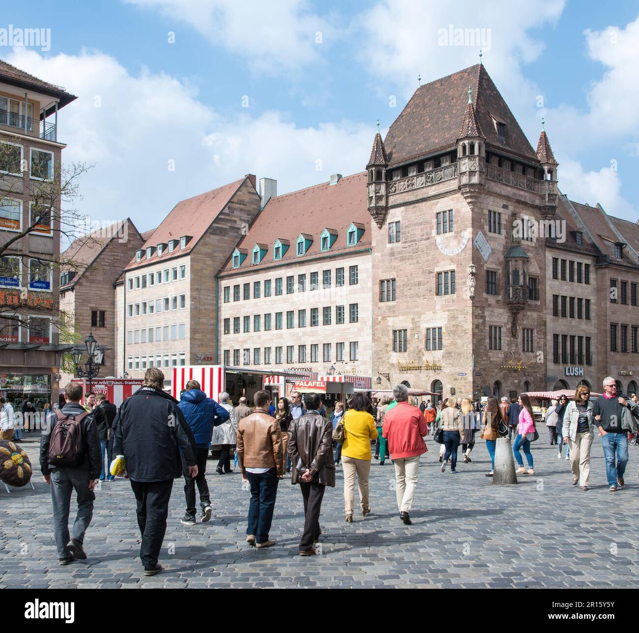 NUERNBERG, GERMANY, APRIL 6: Tourist at the Nassauer Haus in Nuernberg, Germany on April 6, 2014. The medieval resicence tower was built in the 13th Stock Photo