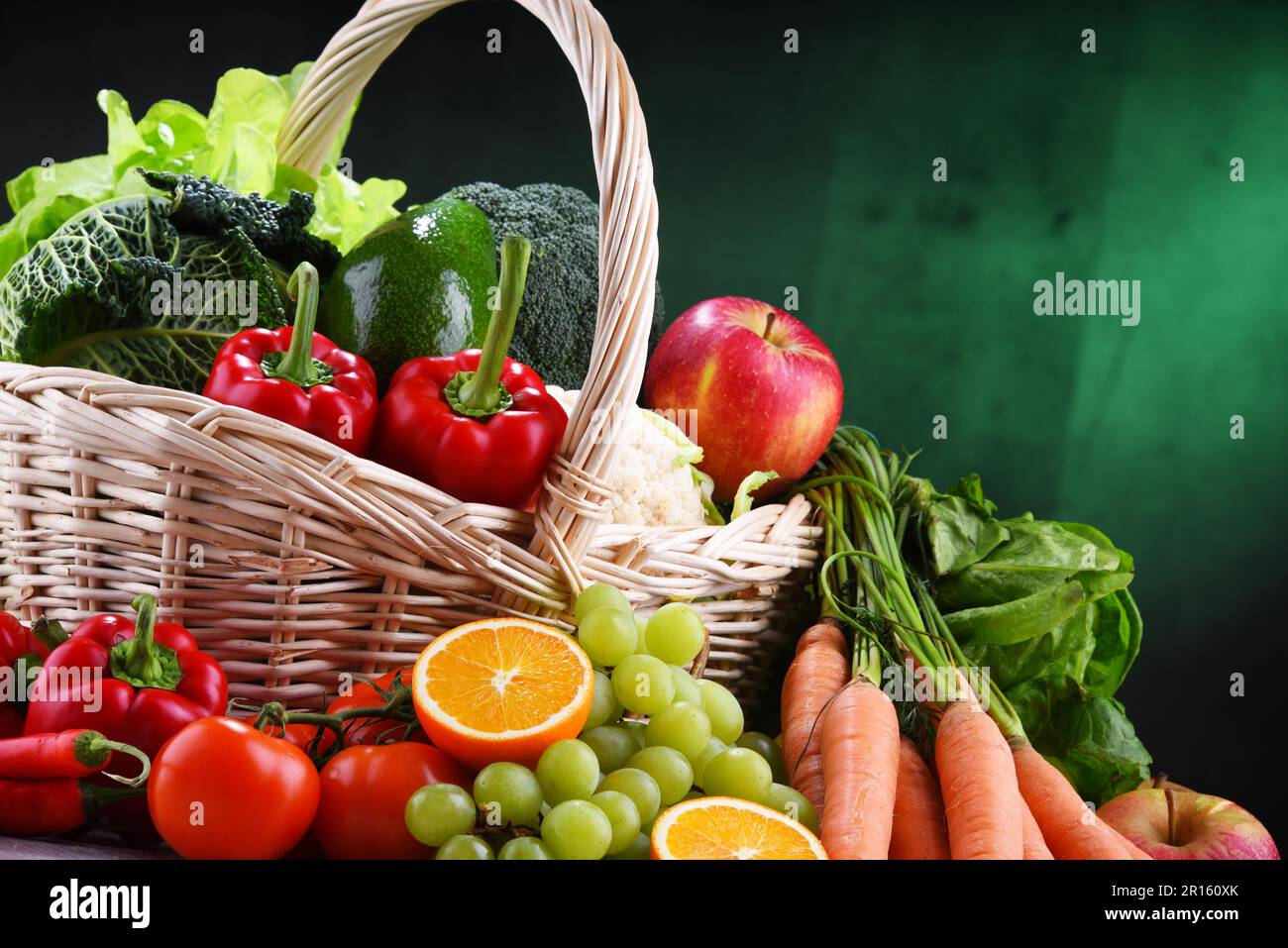 Fresh organic fruits and vegetables in wicker basket Stock Photo - Alamy