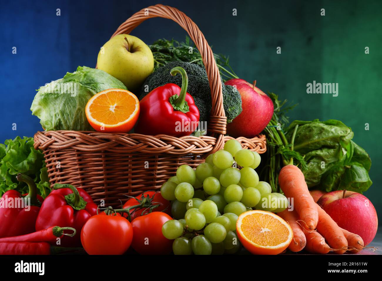 Fresh organic fruits and vegetables in wicker basket Stock Photo - Alamy