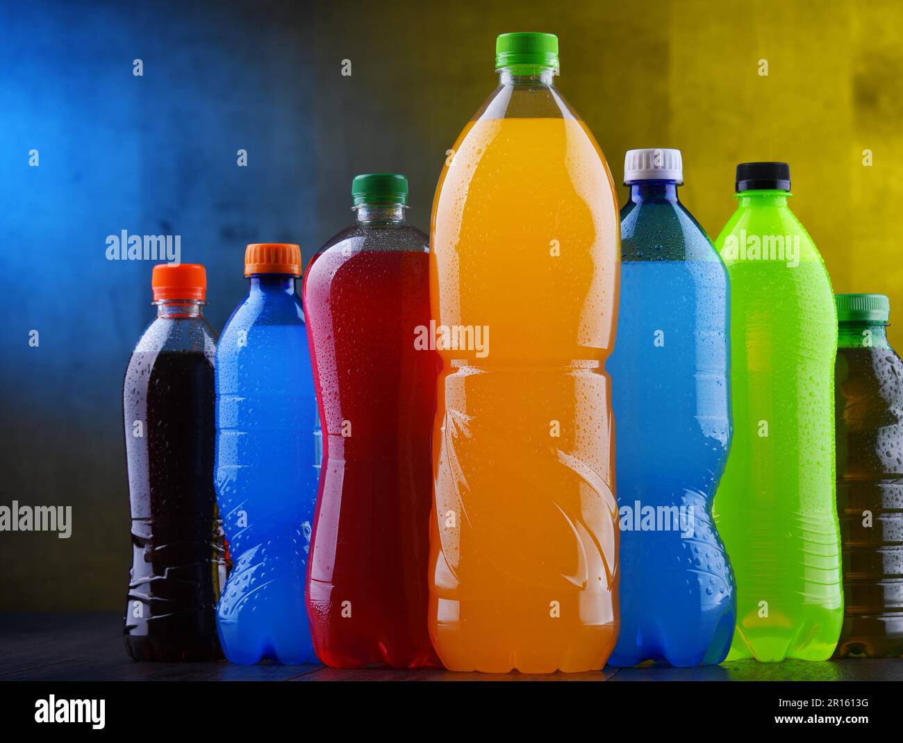 Plastic bottles of assorted carbonated soft drinks in variety of colors