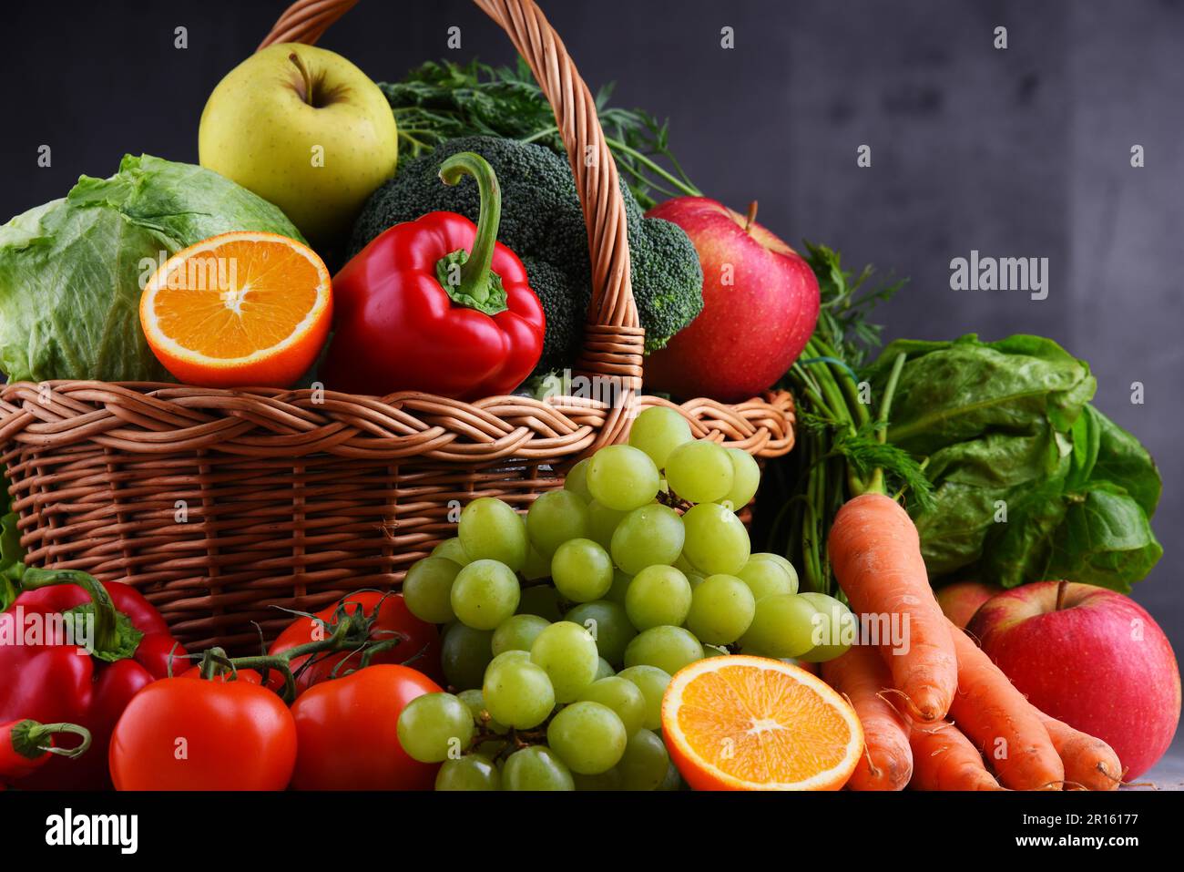 Fresh organic fruits and vegetables in wicker basket Stock Photo - Alamy