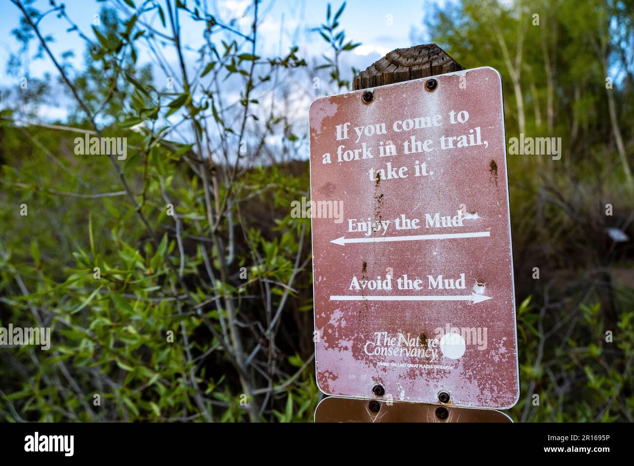 'If you come to a fork in the trail, take it' -- Sign at the Santa Fe Canyon Preserve, Santa Fe, New Mexico, USA Stock Photo