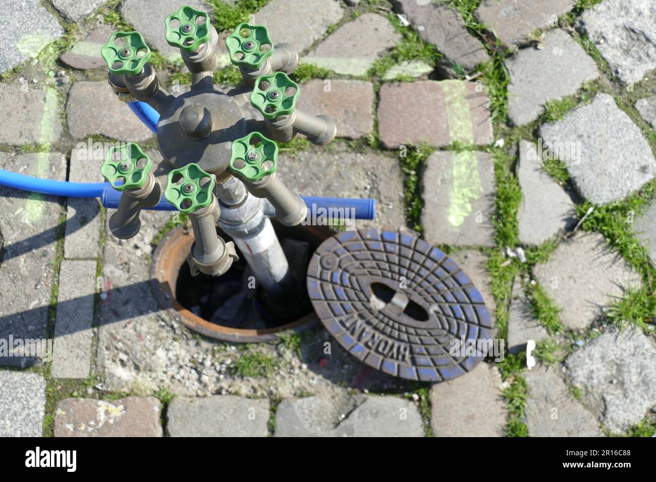 Standpipe with water taps at an underground hydrant, Germany Stock ...