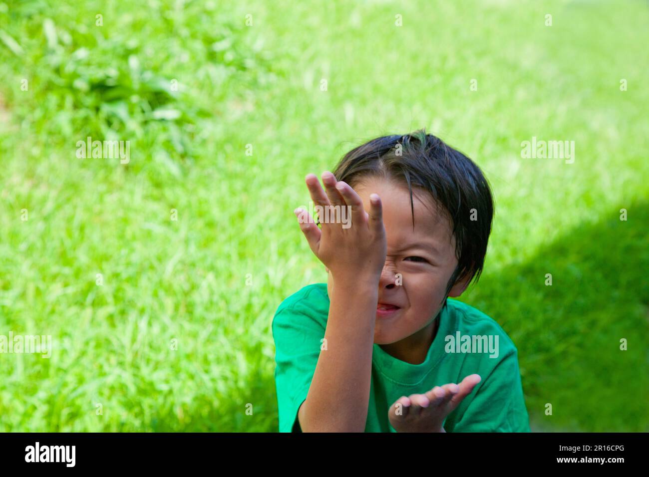 Boy rubbing his face Stock Photo Alamy