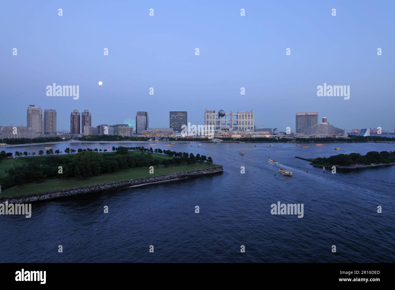 Full moon and Odaiba Seaside Park and maritime subcity center buldings Stock Photo