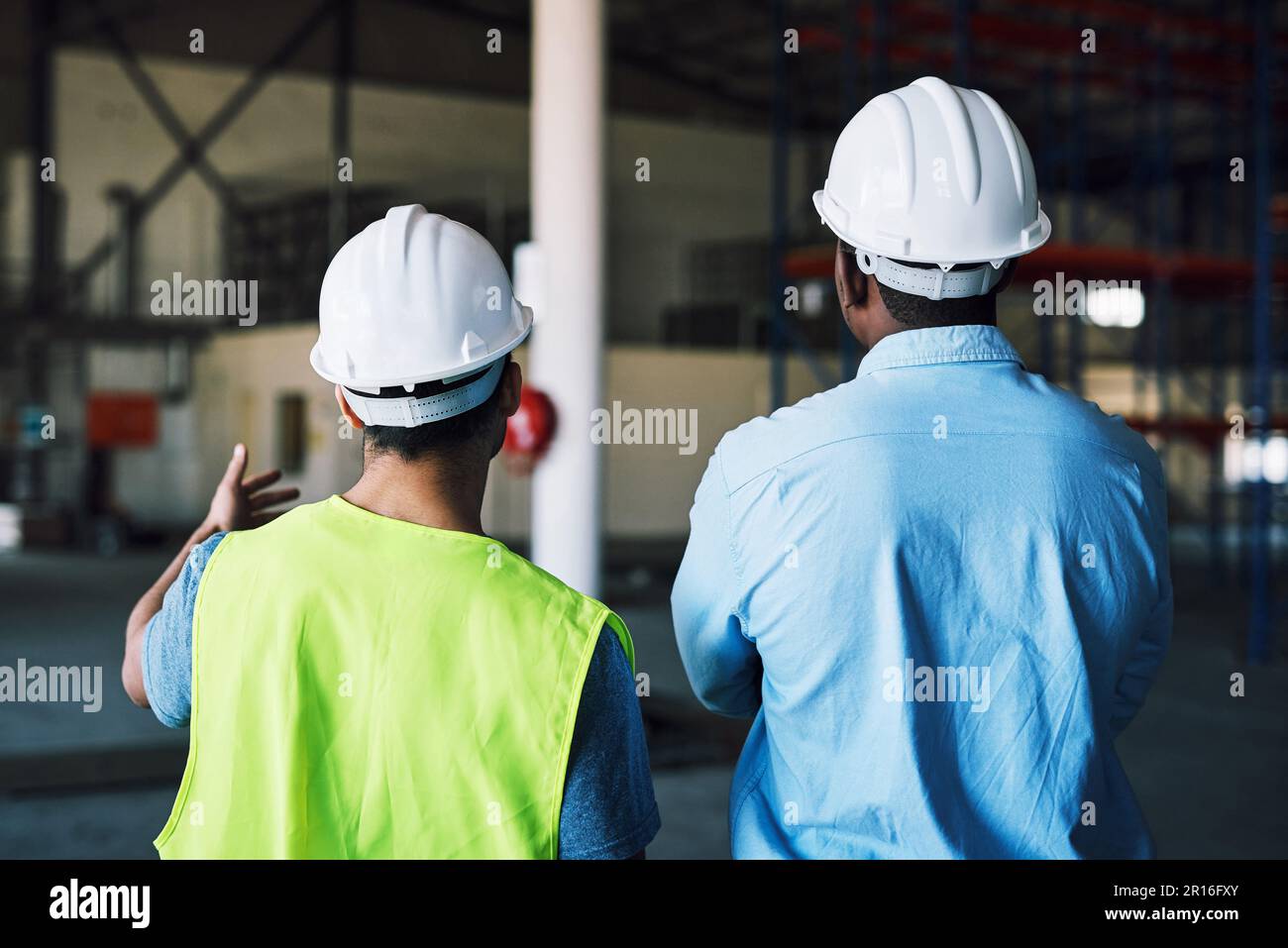 What the client wants, the client gets. two builders inspecting a construction site. Stock Photo