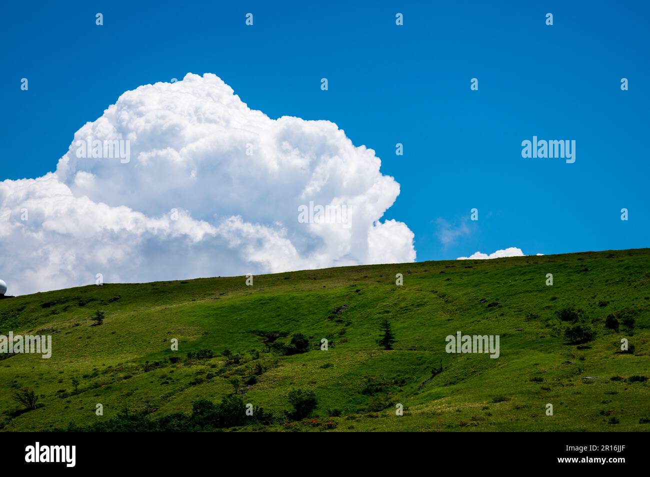 Car mount and cumulonimbus clouds Stock Photo