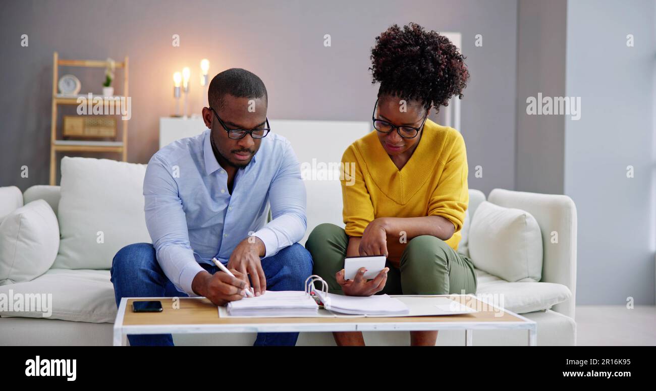 African Couple Doing Financial Budgeting And Income Taxes Stock Photo