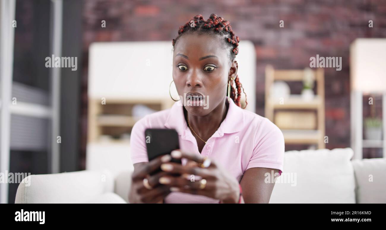 African American Women With Mobile Phone In Hand Stock Photo