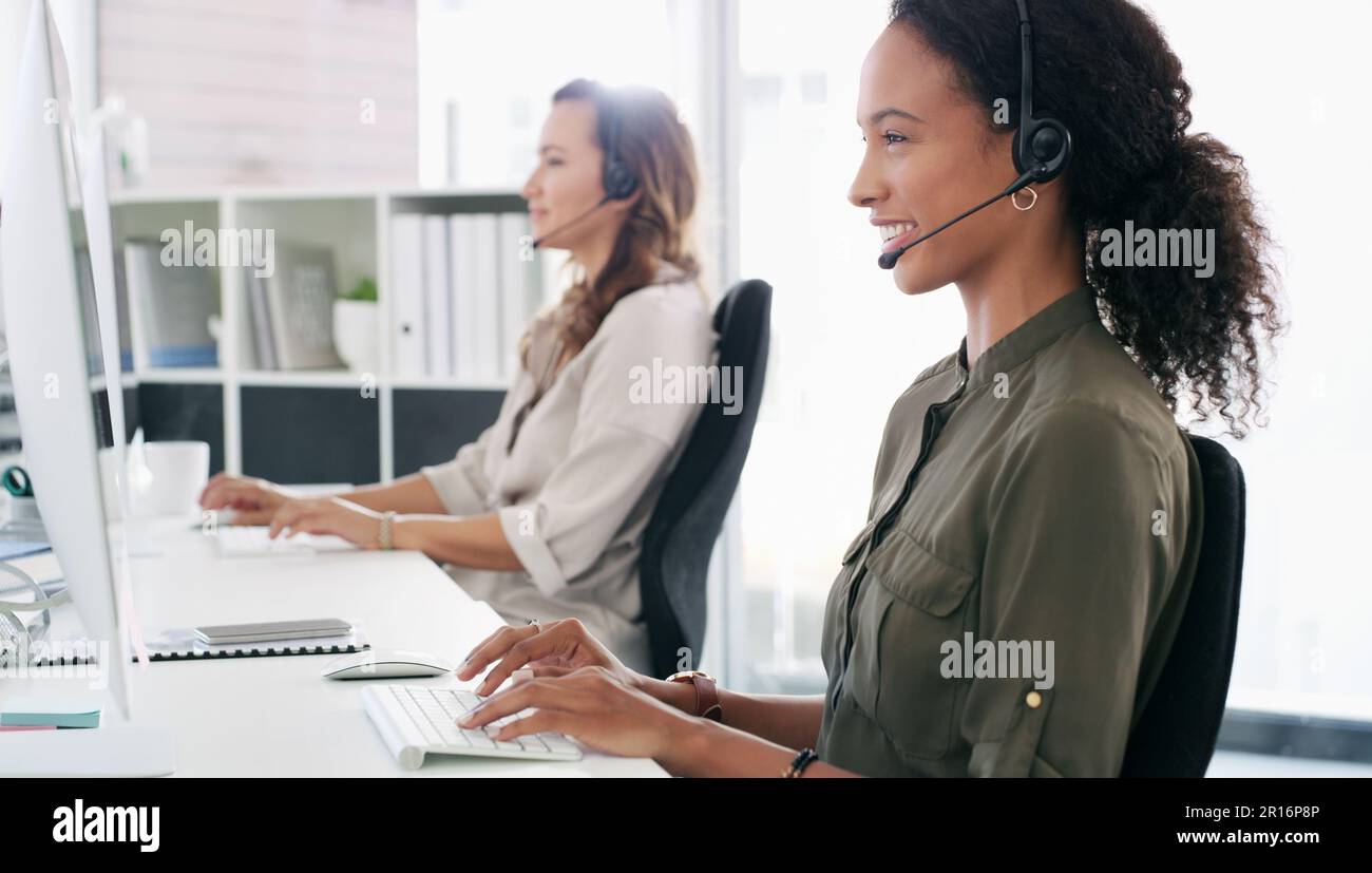 Turning every query into a workable solution. a young woman using a ...