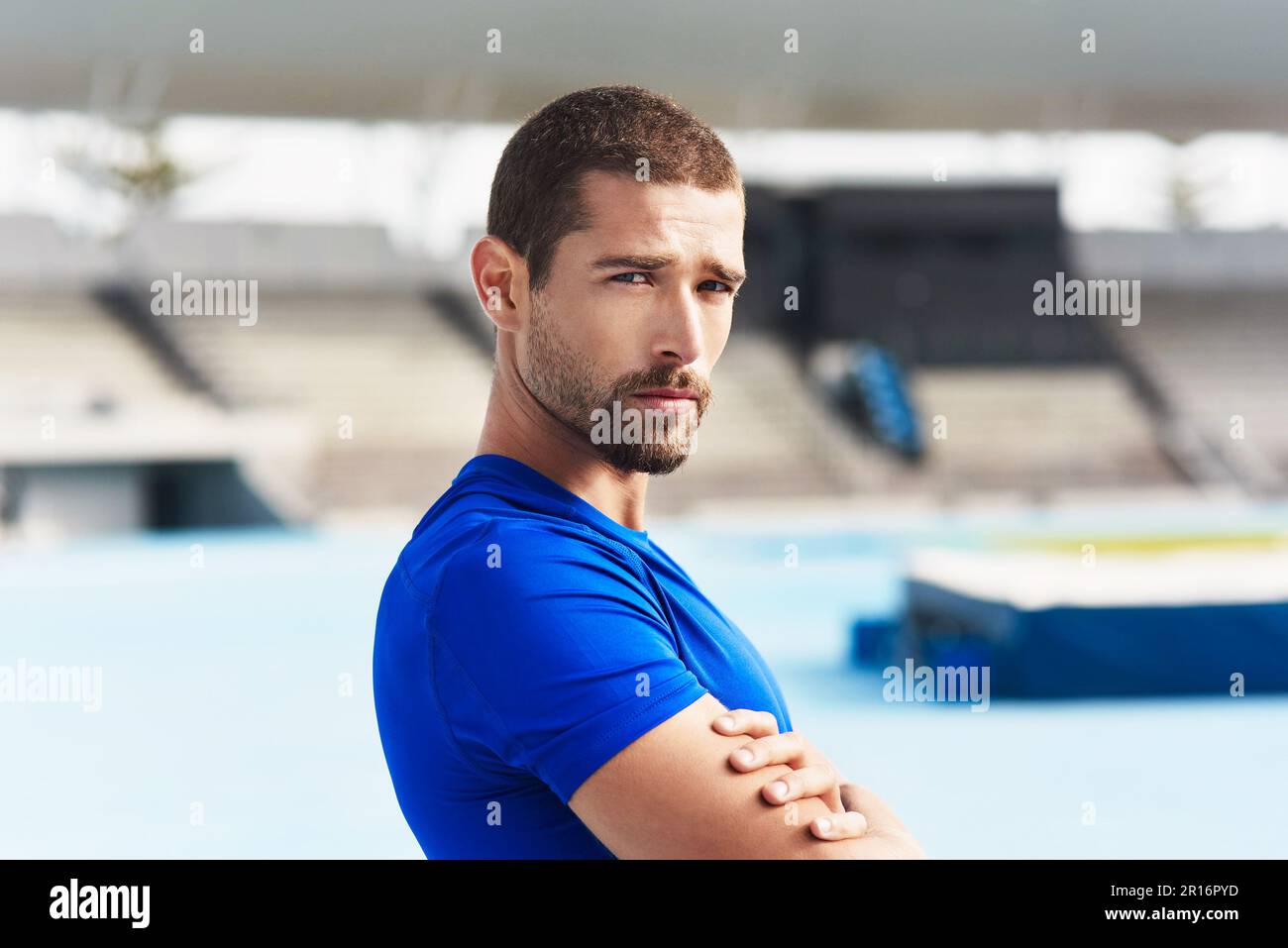 Male athlete standing arms hi-res stock photography and images - Alamy