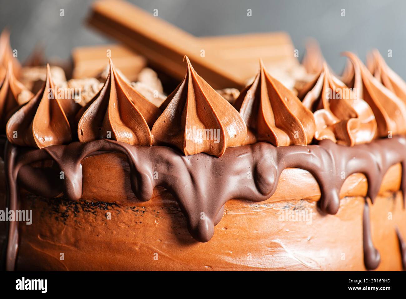 Deliciously moist Chocolate Mud Cake with whipped ganache, milk