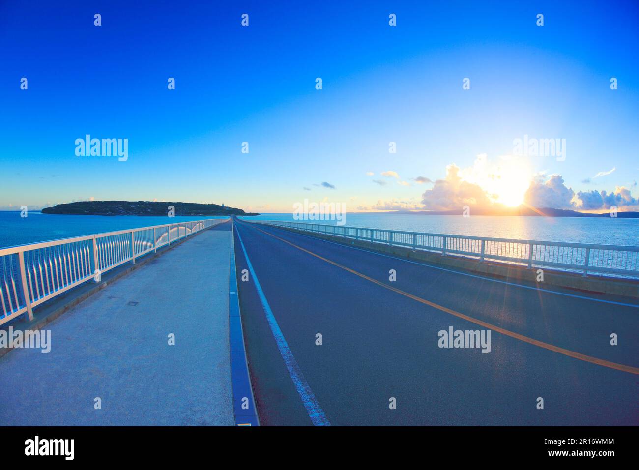 Kouriohashi bridge, Kourishima island and the morning sun Stock Photo