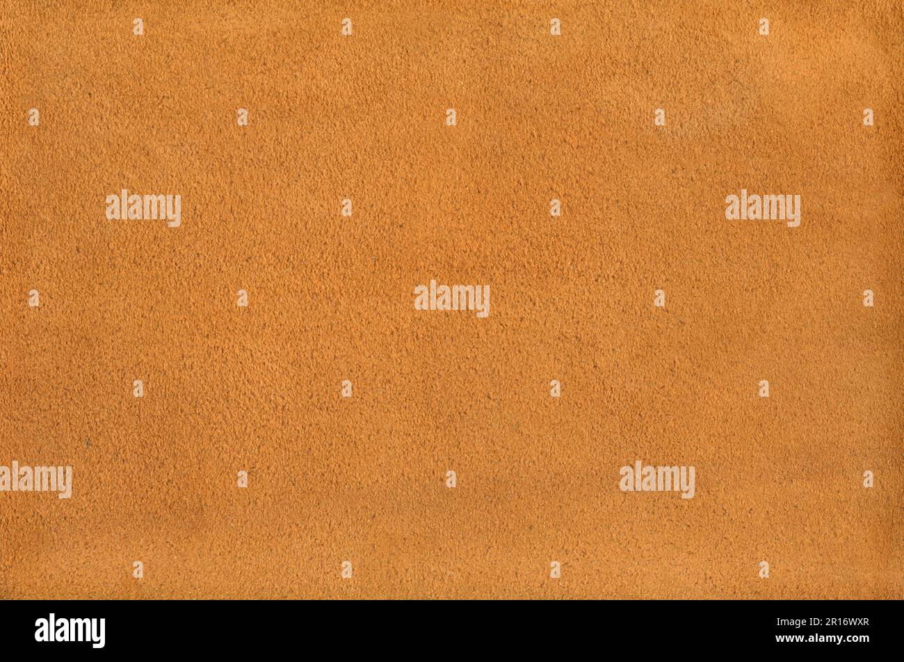 Orange suede leather texture background. Natural material pattern. Stock Photo