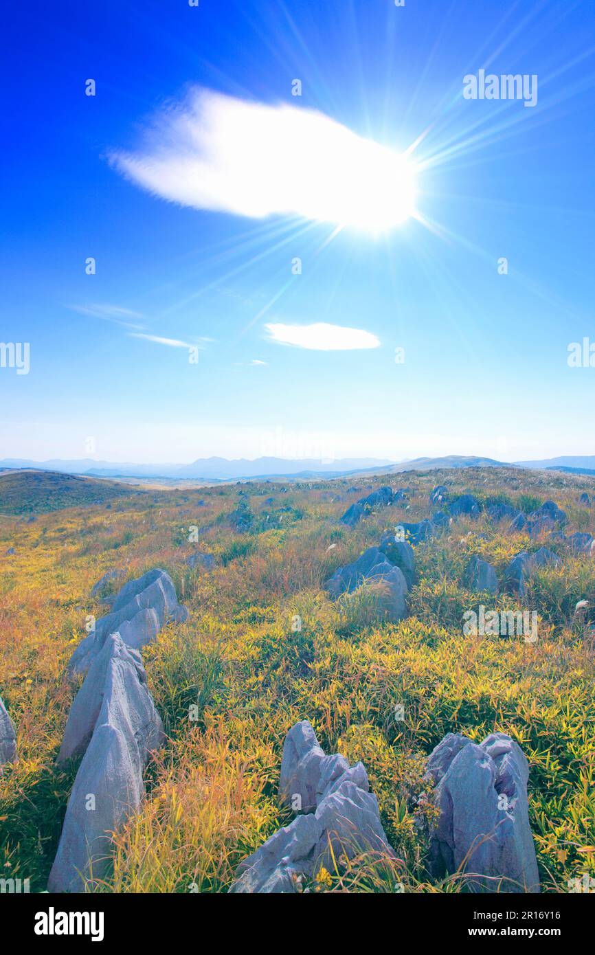 Landscape of the sun coming out of the clouds , limestone of Karst plateau and mountains such as Ryugomine Stock Photo