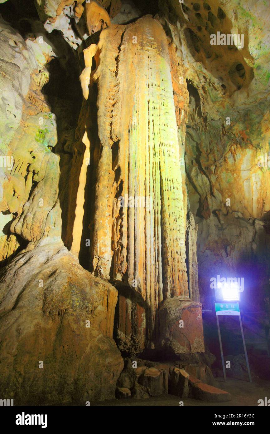 Guide Plate And Illumination Of Golden Pillar Stalactites Stock Photo guide-plate-and-illumination-of-golden-pillar-stalactites-stock-photo